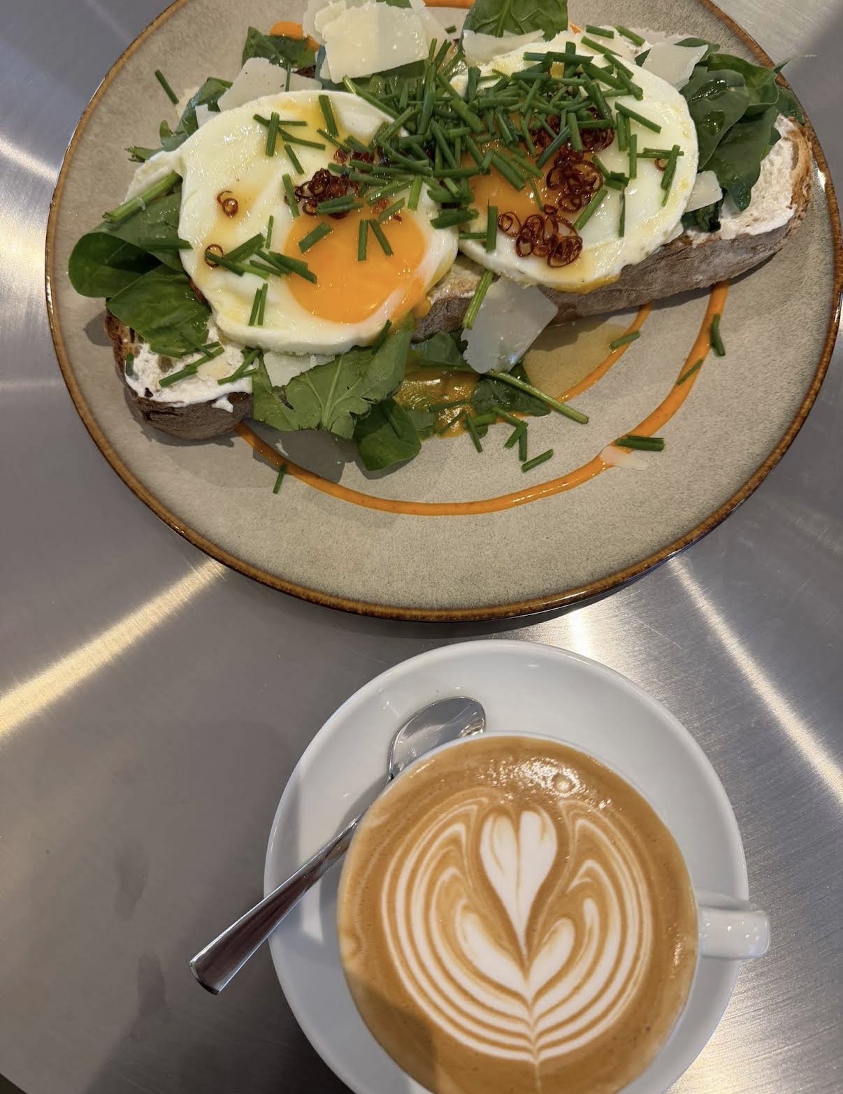Eggs on sourdough with chili oil and chives
